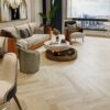 Herringbone floor Barlinek Oak Salt installed on living room floor.