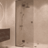 Framed shower screen with fixed part Hietakari Vetro 517, black fittings, bronze tinted glass Framed shower screen with fixed part Hietakari Vetro 517, black fittings, bronze tinted glass