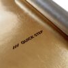 подложка-под-ламинат-и-паркет-quick-step-silentwalk Подложка под ламинат и паркет Quick Step Silent Walk с золотистой пароизоляцией. Рулон наполовину развернут на черновом полу.