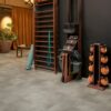 vinyl-floor-tiles-quick-step-oro-concrete-rock Vinyl floor tiles Quick-Step Oro Concrete rock installed on a home Jim floor. Ladder on wall, yoga mat.