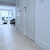 White herringbone parquet Bauwerk Monopark Oak Natur 15 Farina in a hallway Herringbone parquet Bauwerk Monopark Oak Natur 15 Farina B-Protect® white matt lacquer – 2